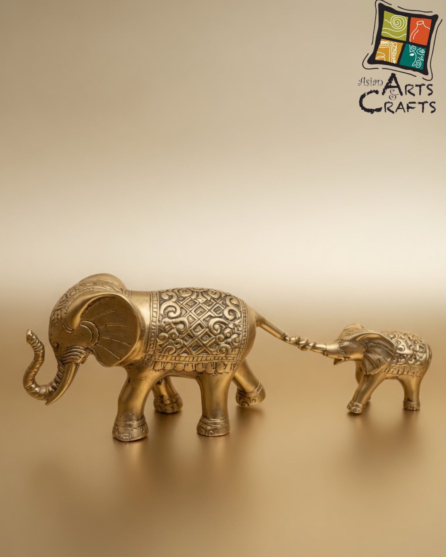 Bronze golden walking elephant with baby